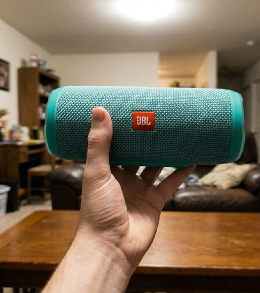 holding speaker in hand